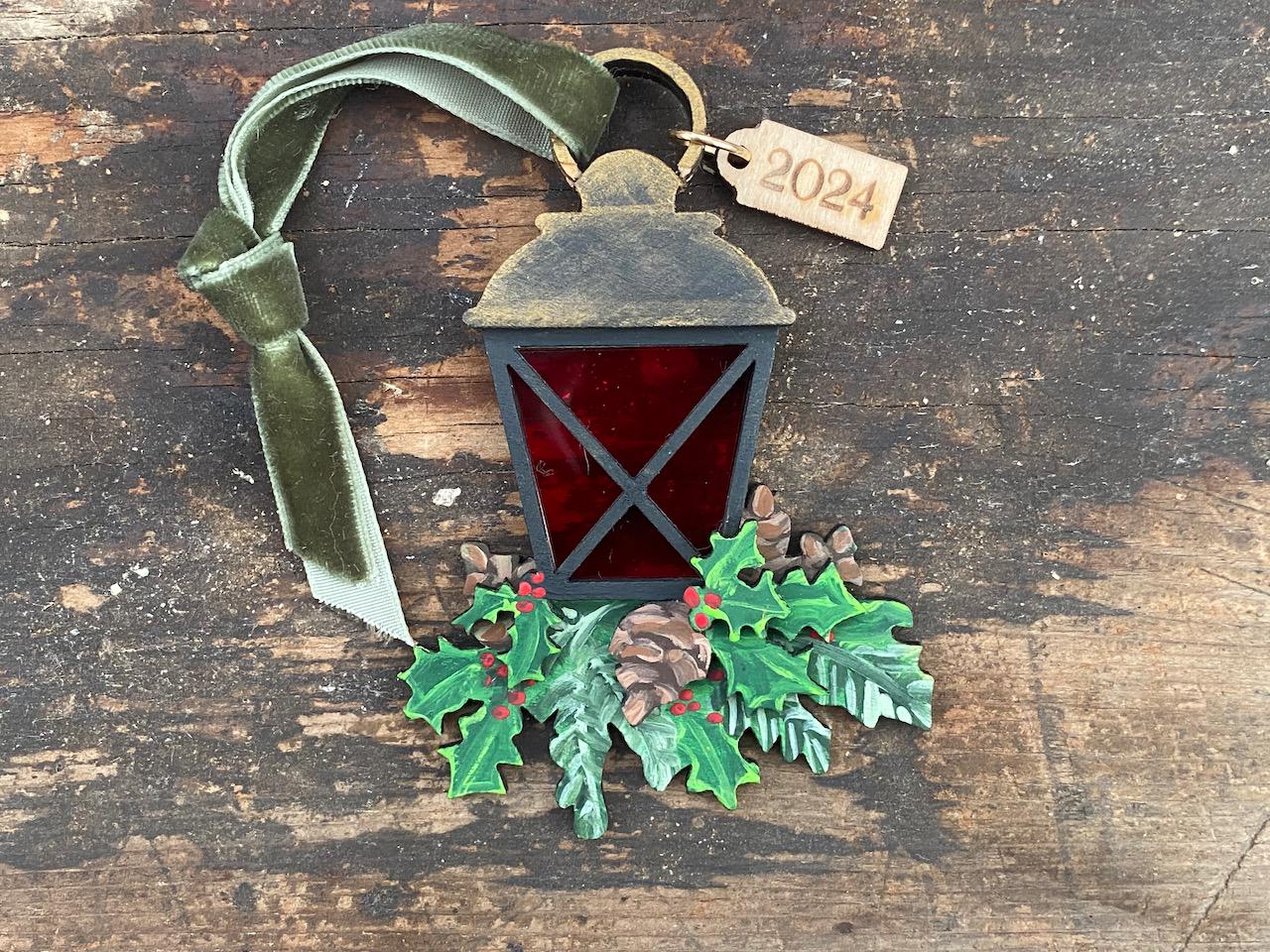 Christmas Lantern on Boughs of Evergreens and Pinecones