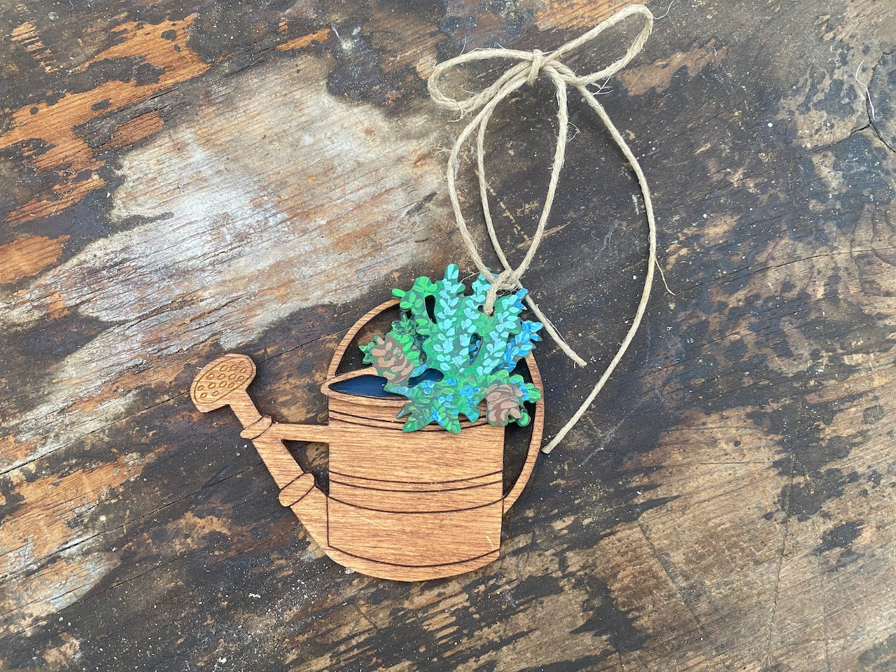 Vintage Watering Can with Pointsettia Ornament for Garden Lovers