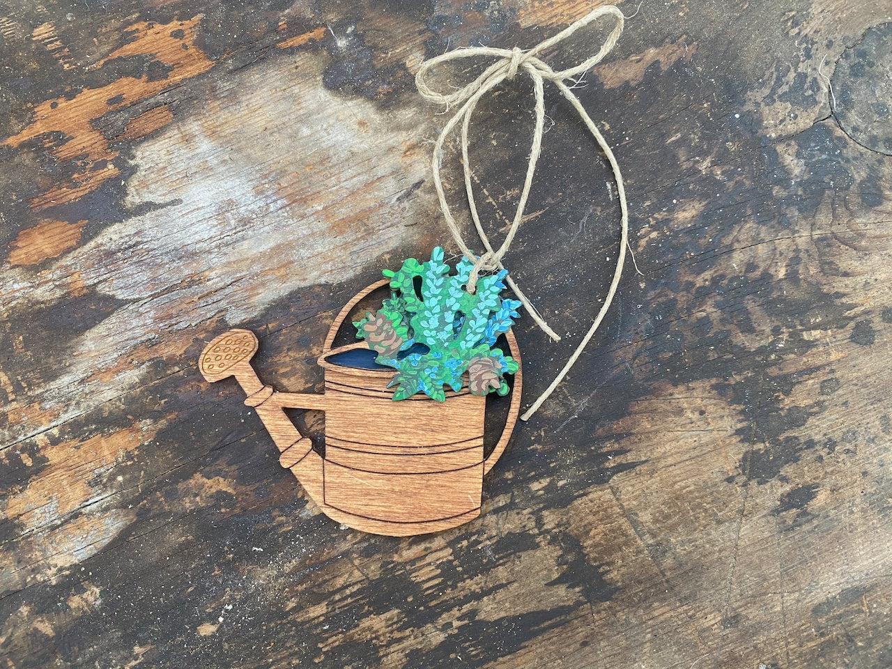 Vintage Watering Can with Pointsettia Ornament for Garden Lovers